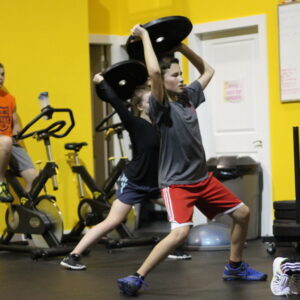 weight discs over head exercise